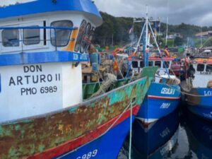 Fishing boats, including Don Arturo II, docked at Puerto Toro, with Quixote Expeditions preparing for their journey to Cape Horn