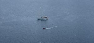 Aerial view of the Ocean Tramp navigating the cold waters of Antarctica