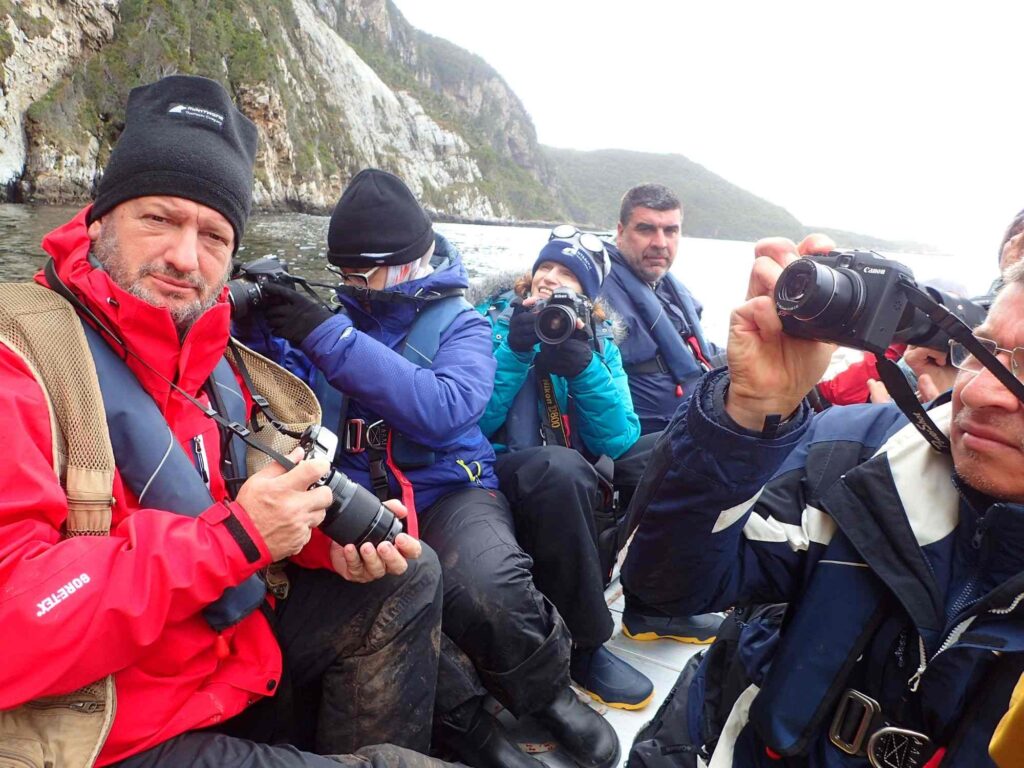 group of people taking photos on Isla de los Estados